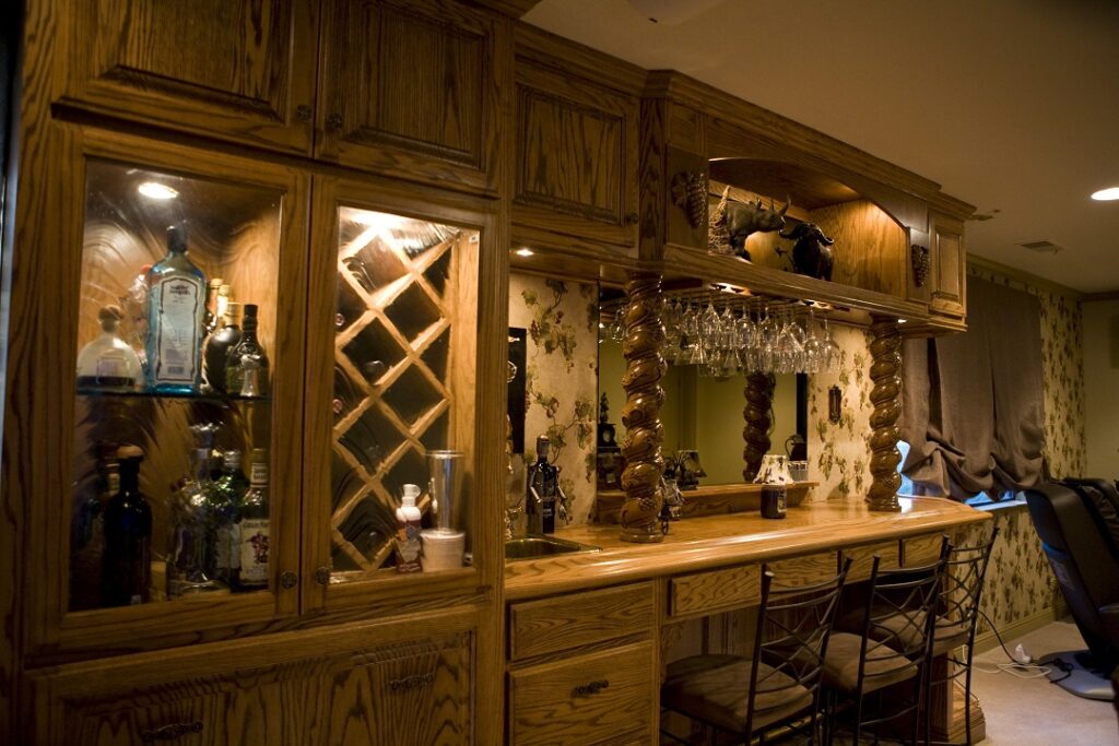 custom cabinet with wine racks and oak bar top