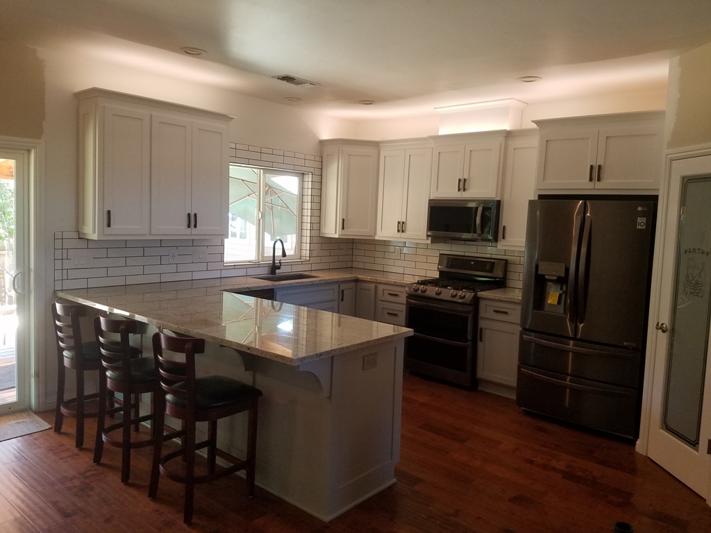 shaker style kitchen with white wall cabinets and grey base cabinets