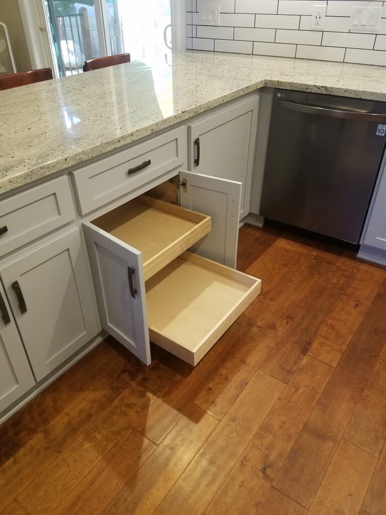 kitchen base cabinet with solid maple dovetailed rollouts on blum soft close glides.