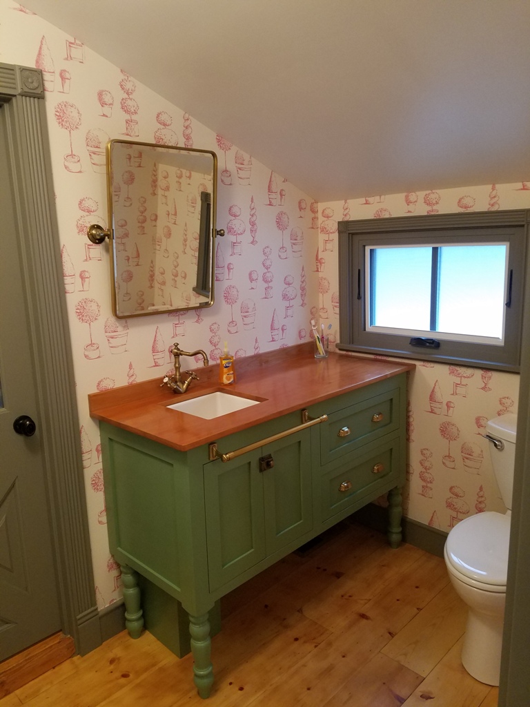 furniture style vanity cabinet with turned legs and dovetailed drawers